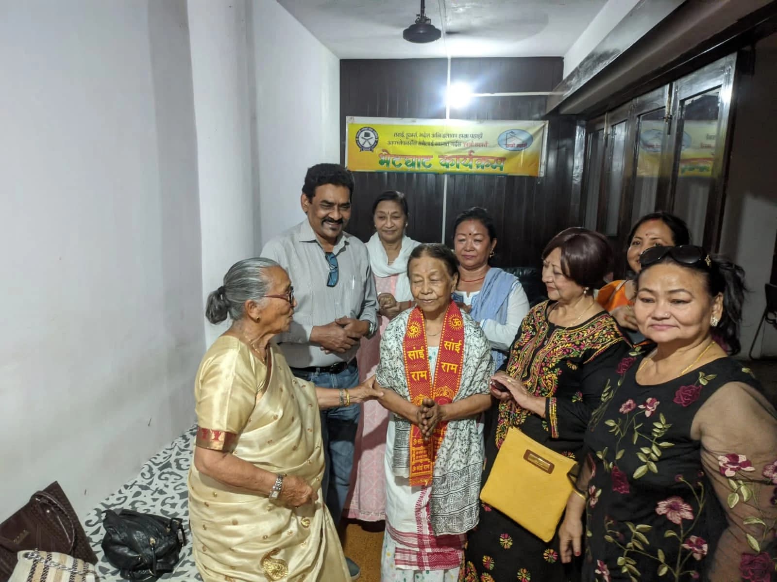 Bhetghat programme · elderly patient felicitated with Sai Ram stole