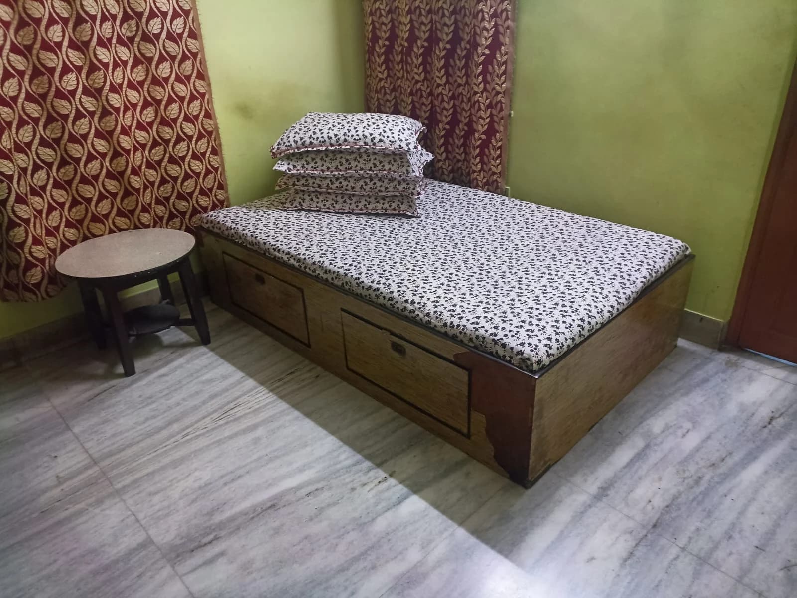 Kolkata ashram — comfortable room with storage bed